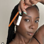 reef-friendly makeup Dark skinned Black woman holding white and orange makeup containers