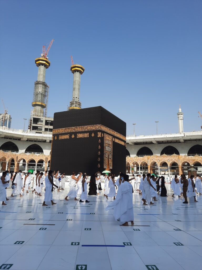 People walking in front of the Holy Kaba